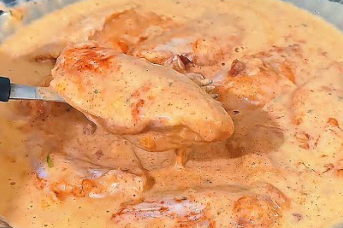 Golden crispy breaded chicken wings piled on a plate, freshly fried and ready to serve